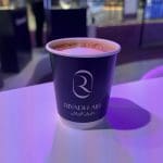 Recyclable Riyadh Air branded coffee cups designed and produced by Events Lab Agency.