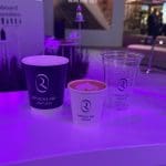 Recyclable Riyadh Air branded coffee cups designed and produced by Events Lab Agency.