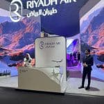 Riyadh Air stand at World Travel Market 2025 with branded hospitality setup.