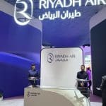 Riyadh Air stand at World Travel Market 2025 with branded hospitality setup.