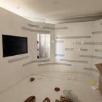 Custom exhibition build with illuminated branding and recessed displays